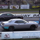 Illustration for article titled A Demon Versus Hellcat Drag Battle Is Just As Intense As You Think It Would Be